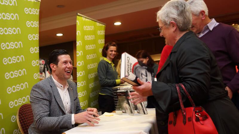 Sean Cavanagh signing copies of his autobiography, 'The Obsession'.