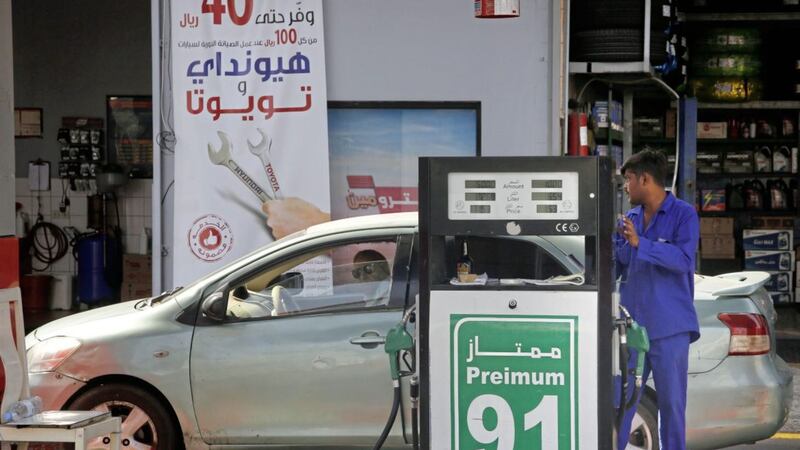 A worker refuels a car at a gas station in Jiddah, Saudi Arabia, on Monday. Picture by Amr Nabil, Associated Press 