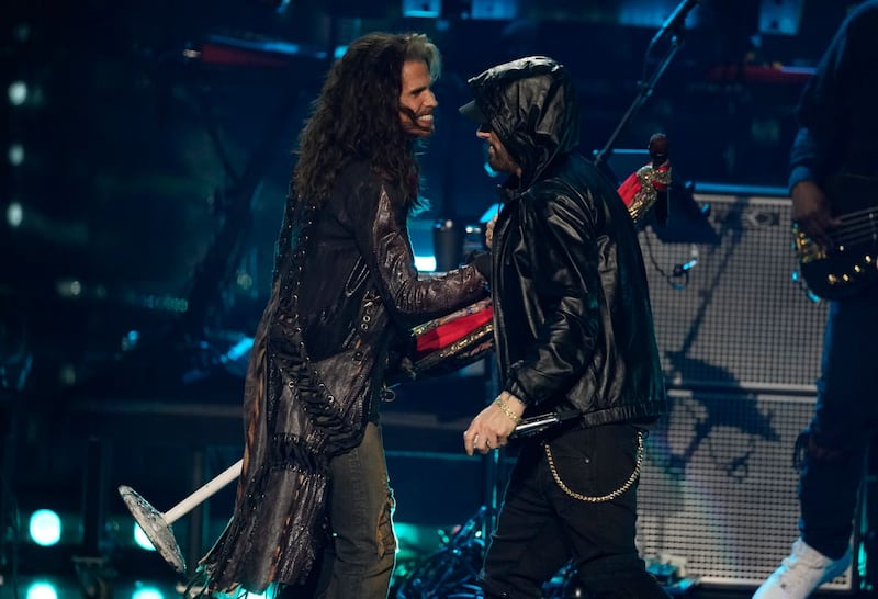 Inductee Eminem, right, and Steven Tyler appear during the Rock & Roll Hall of Fame induction ceremony at the Microsoft Theatre in Los Angeles 