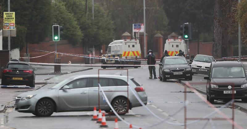Police at the scene where Jim Donegan was shot dead on the Glen Road in west Belfast in 2028