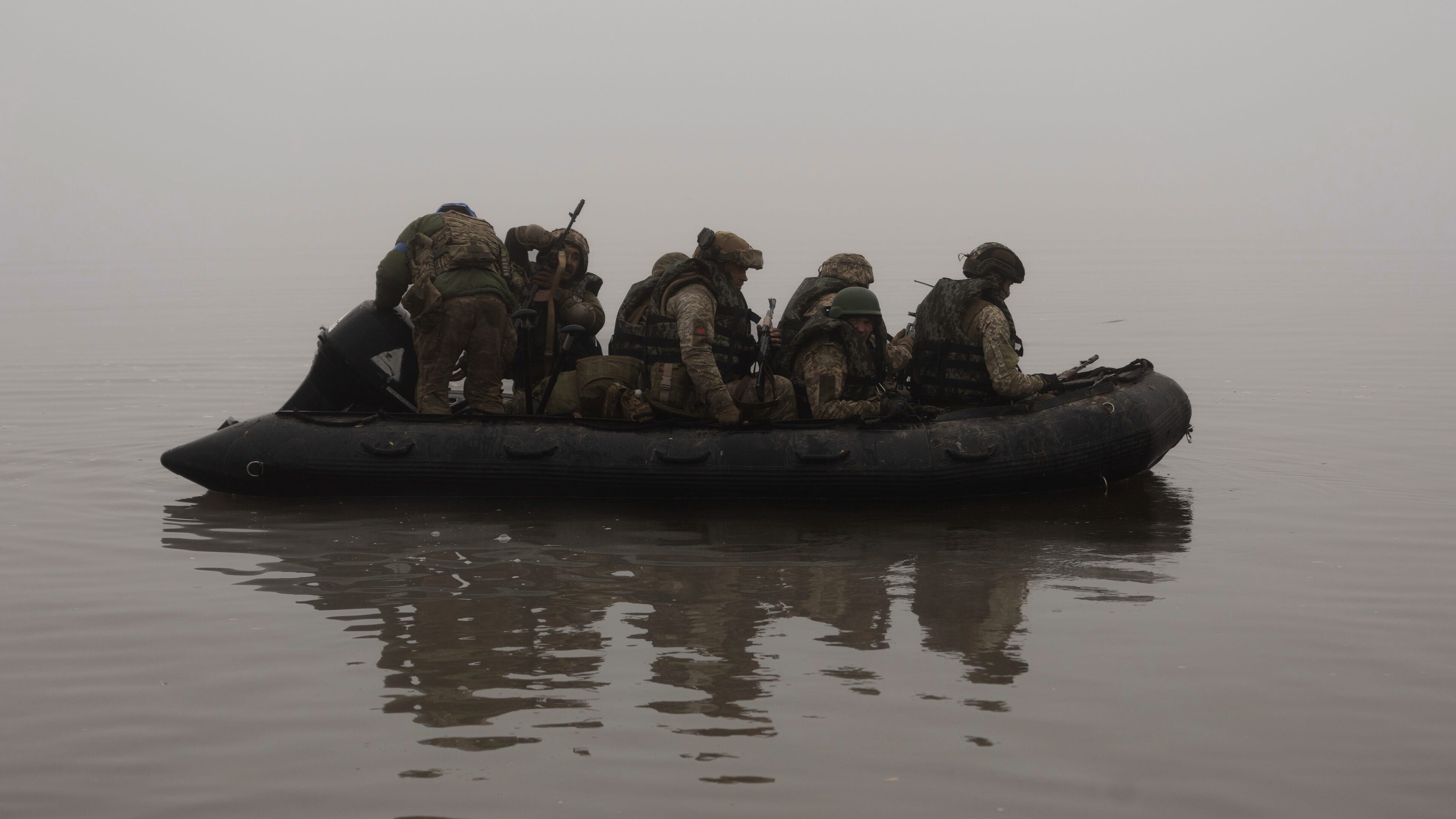 Ukrainian marines sail along the Dnipro river at the frontline near Kherson (AP)