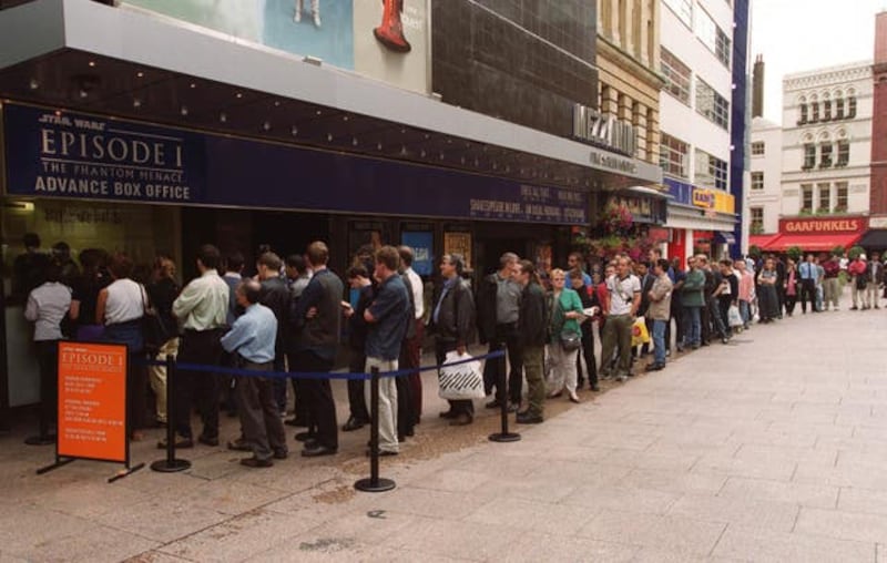 Star Wars fans queue outside the Odeon Leicester Square cinema in London on the opening day of Star Wars: The Phantom Menace in 1999 