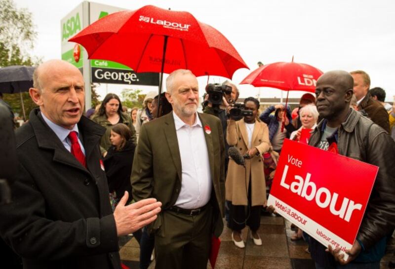 Planning Secretary John Healey (left) and Labour leader Jeremy Corbyn meet supporters 