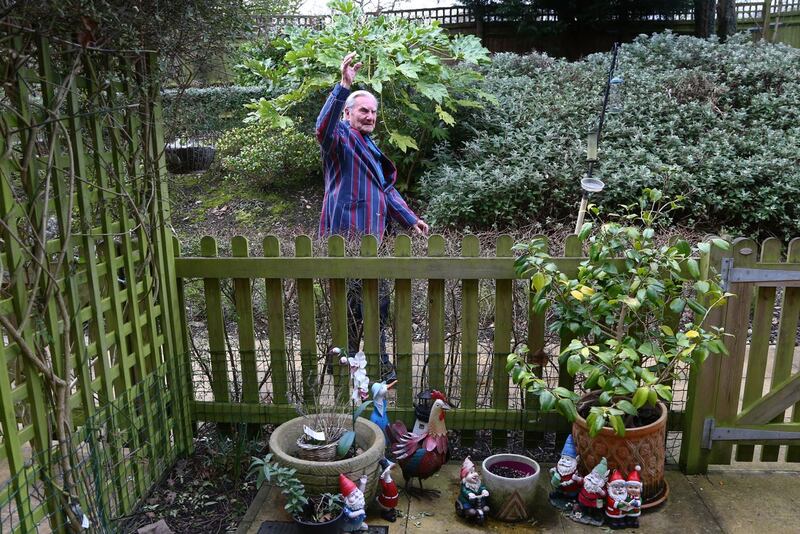 Tom Jones, 103, walks laps of the garden at his care home in Bexleyheath, Kent