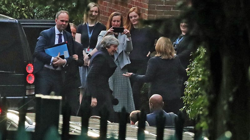 British prime minister Theresa May and her chief of staff Gavin Barwell (left) are greeted by Secretary of State Karen Bradley (right, back to camera) as they arrive at Stormont for talks on Brexit with party leaders on the second day of her visit to Belfast&nbsp;