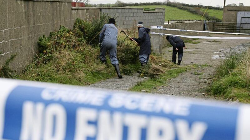 Garda search a farmhouse in 2007 close to where Paul Quinn was murdered. 