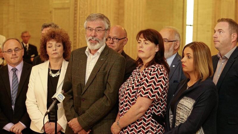 Sinn F&eacute;in president Gerry Adams with the party&#39;s seven MPs at Stormont. Picture by Mal McCann 