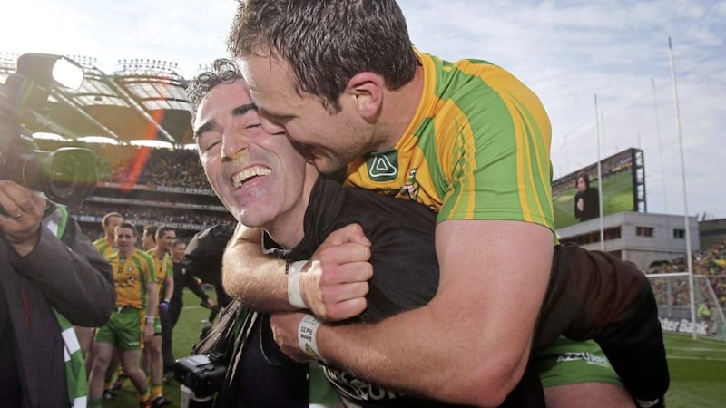 Michael Murphy celebrates with Jim McGuinness after their All-Ireland final win over Mayo in 2012. 