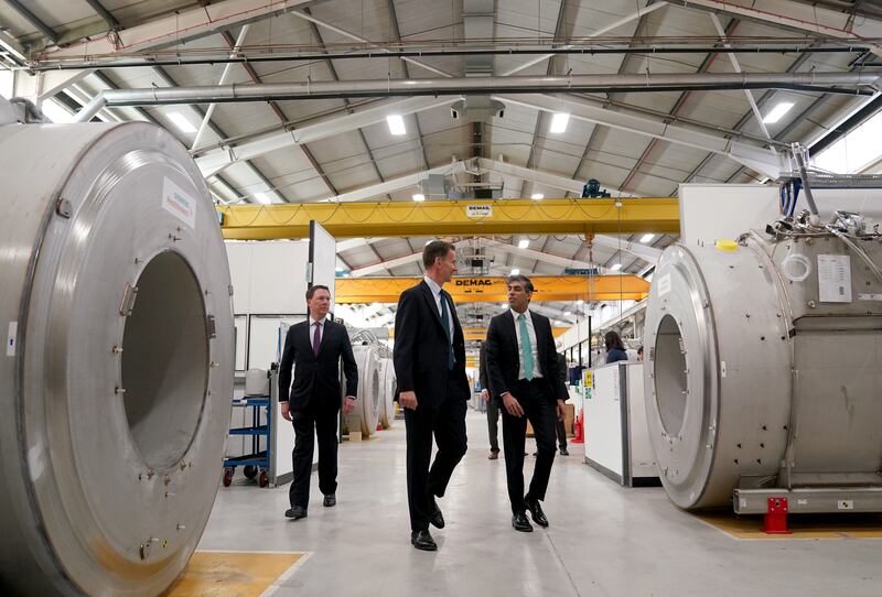 The Prime Minister (right) and the Chancellor (left) were shown around the Siemens Healthineers factory
