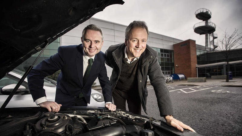 MyCarNeedsA.com managing director Scott Hamilton with Alan Watts, director of Halo which provided &pound;2m for the company 
