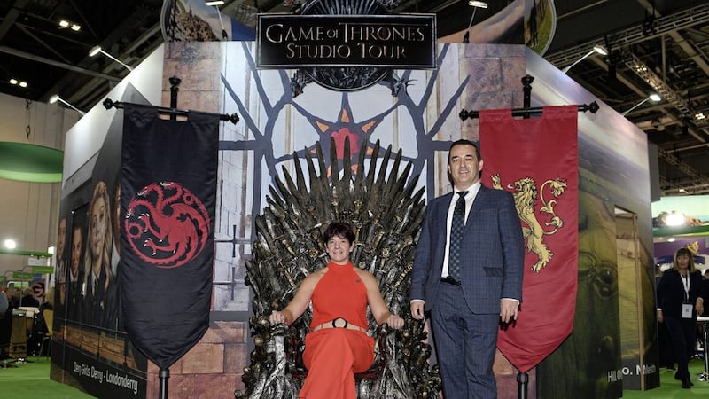 Tourism NI joined Tourism Ireland at the recent World Travel Market at the Excel Centre in London. Seated on the famous Iron Throne is Judy Hutton from the Game of Thrones Studio Tour near Banbridge, alongside David Wood from Tourism Ireland. Picture: Malcolm McNally 