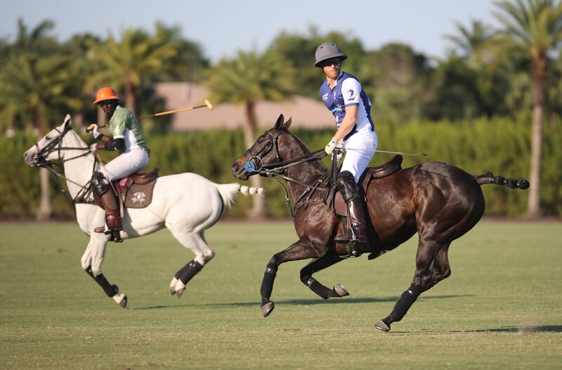 The duke (right) plays in a polo match during the Royal Salute Polo Challenge