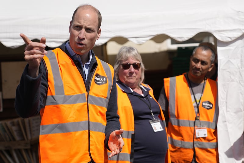 William talks to van drivers during a visit to Surplus to Supper in Surrey