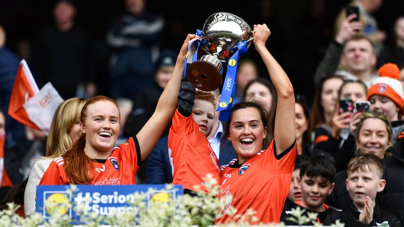 Armagh players and sisters Blaithín Mackin (left) and Aimee Mackin (right) lift the cup with nephew Eoin Shannon (4) after their side's victory in the Lidl Ladies Football National League Division Two final between Armagh and Laois at Croke Park  Picture: Sam Barnes/Sportsfile