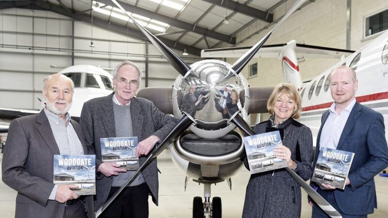 Former Woodgate Aviation managing director Allan Keen, his wife Gloria, and accountable manager David Shaw (right) join author Guy Warner at the launch of his book covering the history of the company 