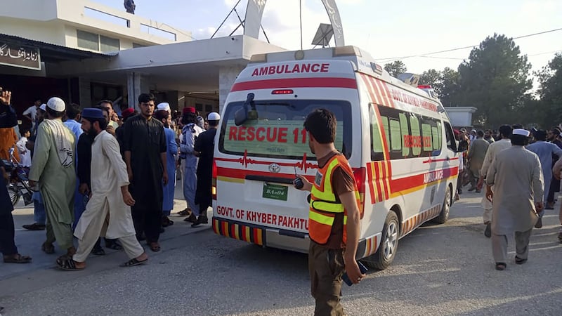 An ambulance carries injured people after the blast (Rescue 1122 Head Quarters via AP)