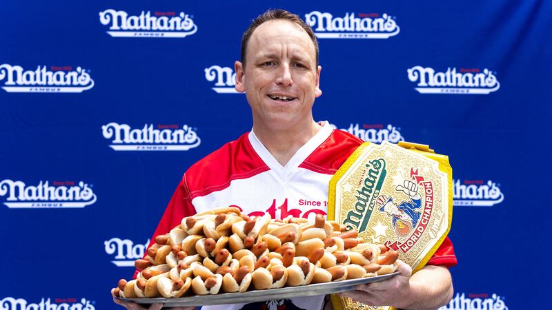 Women’s record-holder Miki Sudo downed 40 hot dogs and buns to win the women’s title.