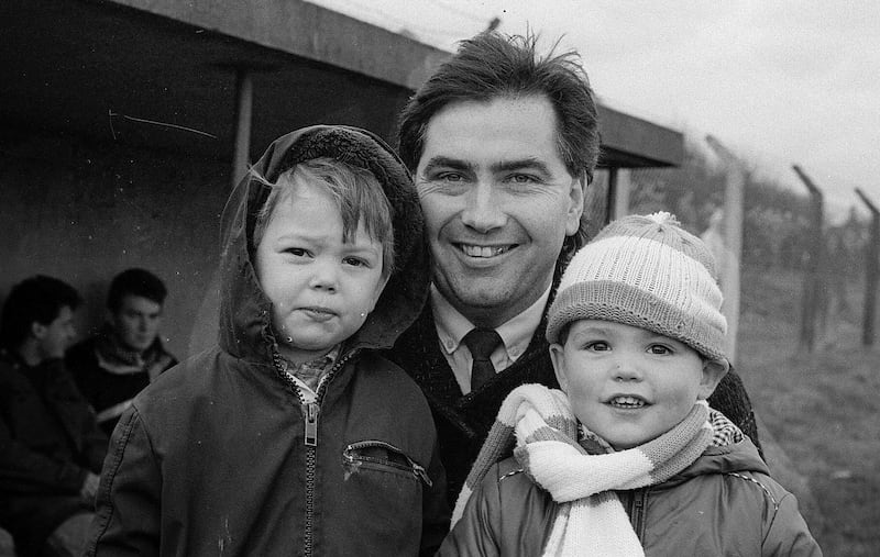 Right back to the start. With his older brother Stephen (left) and dad Joe at an Armagh match in 1986