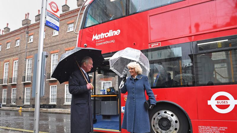 A temporary bus stop was installed at Clarence House to allow the couple to board the environmentally-friendly vehicle.