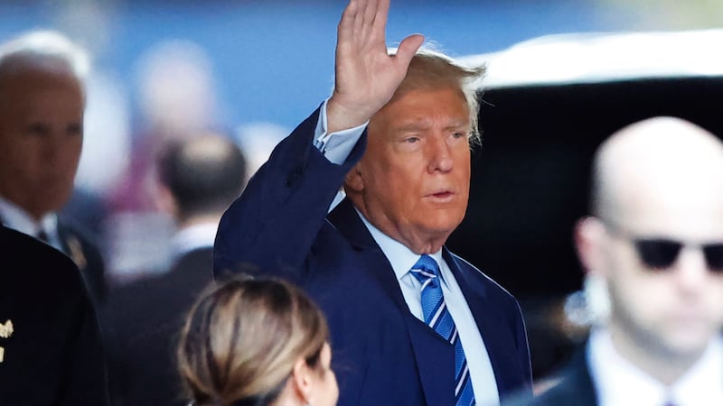 Former President Donald Trump, leaves Trump Tower for Manhattan Criminal Court on Tuesday (Noah K Murray/AP)