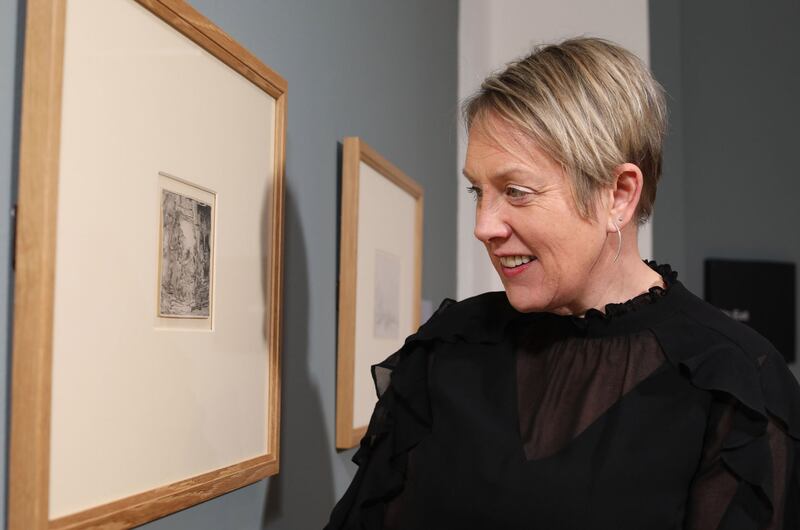 National Museums NI chief executive Kathryn Thomson viewing The Adoration of the Shepherds, which along with another etching by Rembrandt called Six's Bridge, is on display at the Ulster Museum&nbsp;