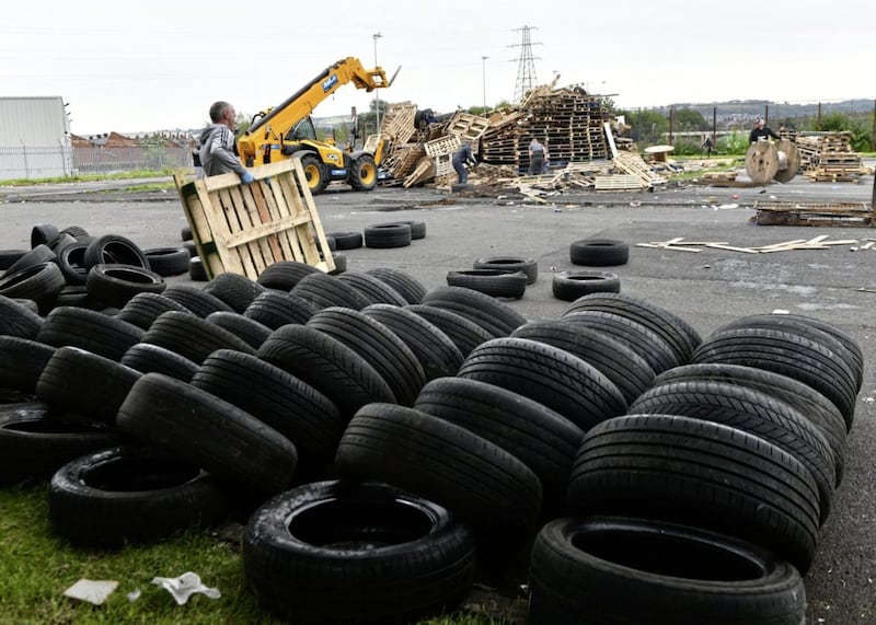 PACEMAKER BELFAST  08/07/2019.Bonfire builders at the Avoniel Leisure Centre site voluntarily remove tyres from their bonfire this afternoon after a ruling from the City Council..A council committee has decided to &acirc;??act in the public interest&acirc;?? and remove materials from two bonfires in east Belfast.The Strategic Policy and Resources Committee met on Monday afternoon to discuss up to eight sites where bonfires have been erected..Photo Pacemaker Press.. 