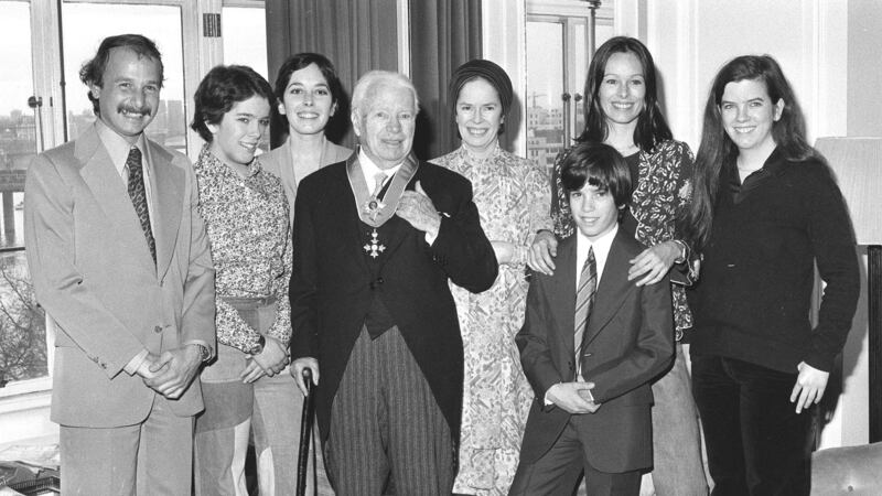 Sir Charlie at the Savoy Hotel in 1975, after being knighted, with his family including son-in-law Nicholas Sistovaris, daughters Annie and Josephine, wife Oona, son Christopher and daughters Geraldine and Jane (PA)
