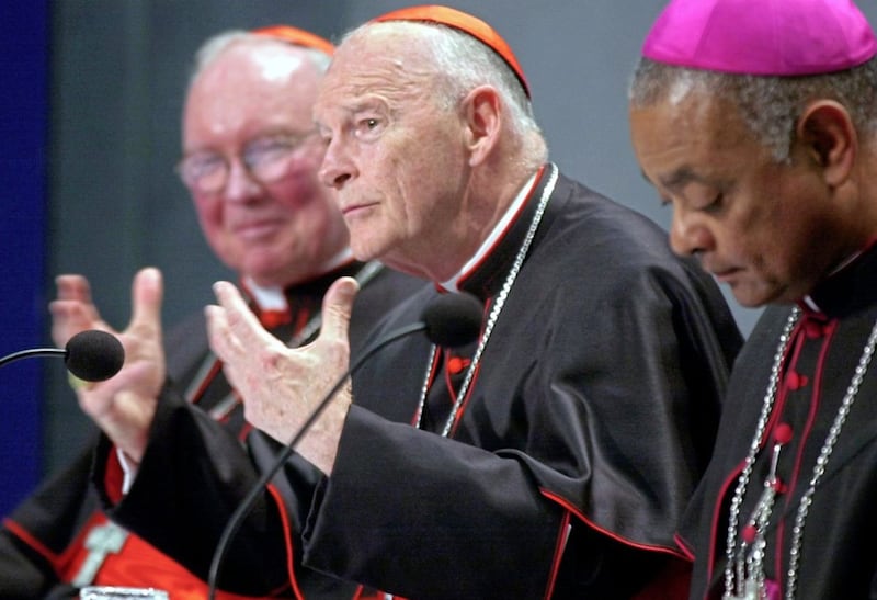 In this April 24 2002 file photo, Cardinal Theodore McCarrick is pictured centre at a Vatican news conference held following a meeting about sex abuse in which the Church in the US agreed to make it easier to remove priests guilty of sexually abusing minors. After years of rumours, McCarrick himself was found guilty of such crimes. Picture by AP Photo/Pier Paolo Cito, File 