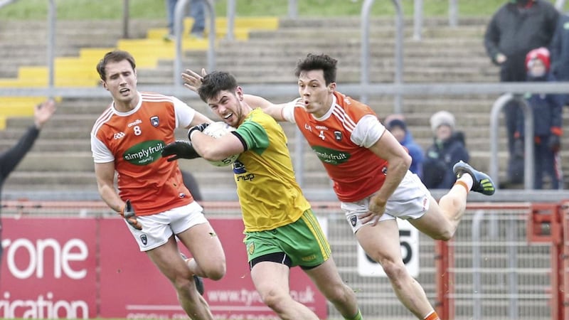 Donegal Ryan McHugh with Stephen Sheridan and James Morgan (4) of Armagh during the McKenna Cup semi final match at Healy Park, Omagh on Sunday January 13 2019. Picture by Margaret McLaughlin. 