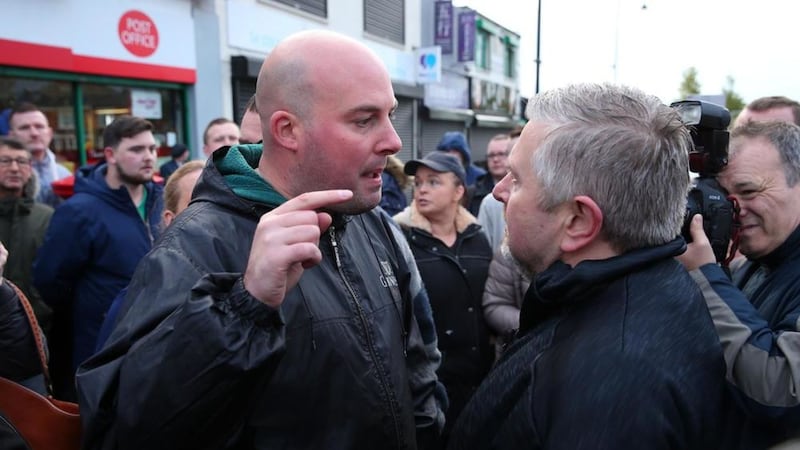 Fr Gary Donegan is confronted at the Ardoyne shops by GARC spokesman Dee Fennell. Picture by Mal McCann 