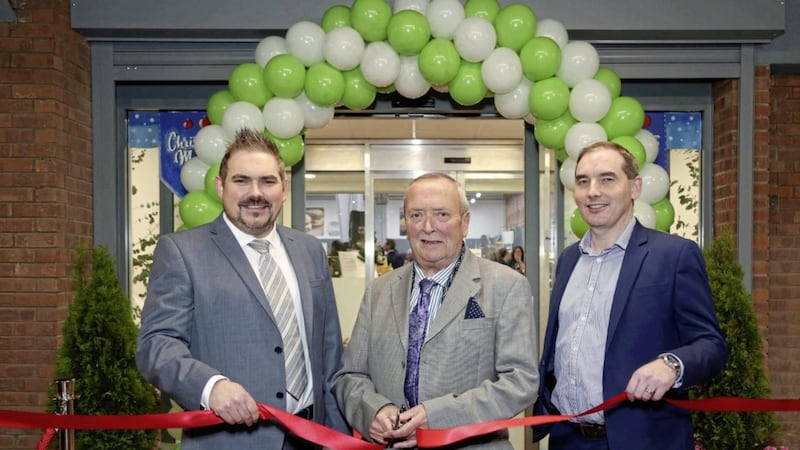 Cutting the ribbon to mark the Musgrave MarketPlace expansion at Duncrue is Michael McGovern, who was one of its first customers when it opened in 1983. Included are Garry Williams (left), general manager and Michael McCormack, managing director. Photo: Darren Kidd/PressEye 