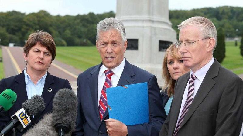 DUP leader Peter Robinson and party colleagues address the media at Stormont after speaking with Secretary of State Theresa Villiers. Picture by Mal McCann