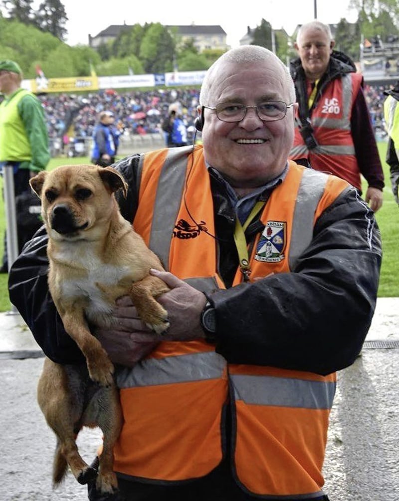 Mickey Graham sr pictured with the dog after Cavan - managed by his son, Mickey jr - had defeated Monaghan