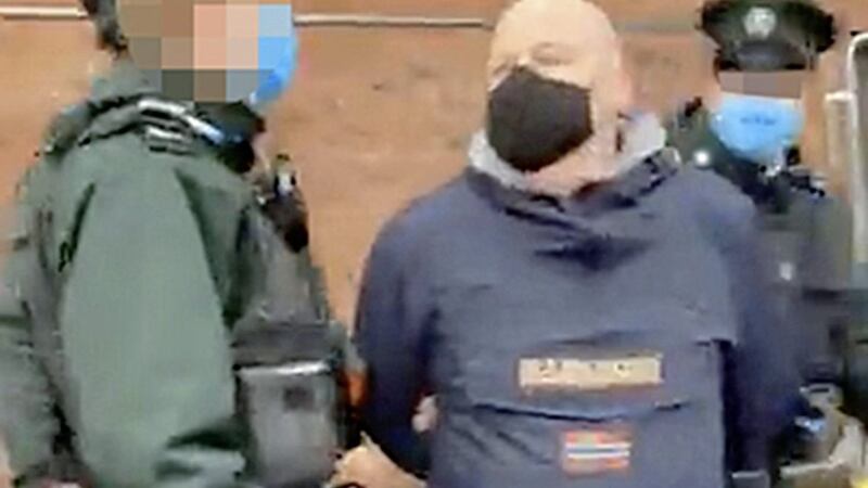 Mark Sykes is led away by police in images posted online 