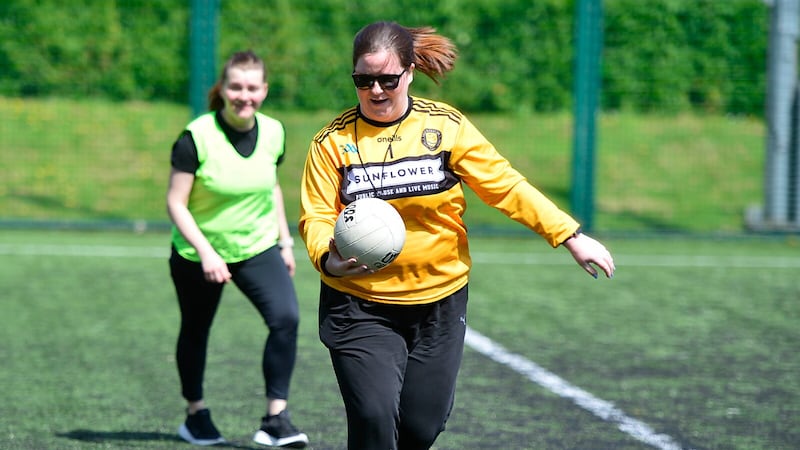 Queen's University welcomed women at Sunday's event to hone skills including Gaelic football and camogie. Picture by Mal McCann