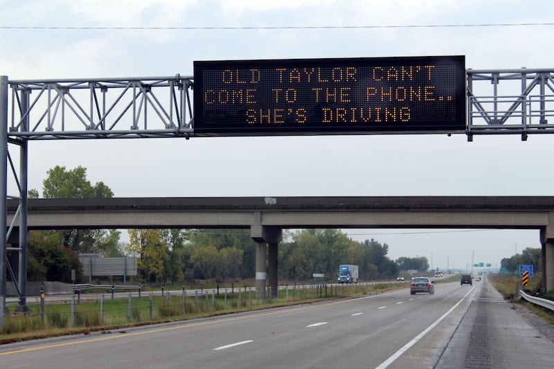 Message board in Iowa reading Old Taylor can't come to the phone.. she's driving (Zero Fatalities/Iowa Department of Transport)