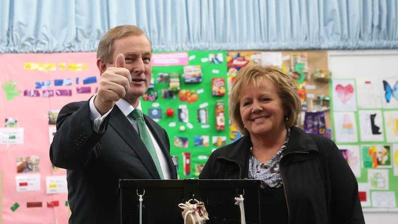 Taoiseach Enda Kenny and his wife Fionnuala cast their votes at a polling station at St Anthony&#39;s School in Castlebar, Mayo. Picture by Brian Lawless, Press Association              