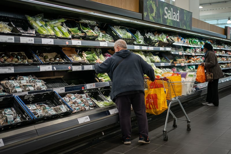 Shoppers in the fruit and vegetables section of a branch of Sainsbury’s in south London