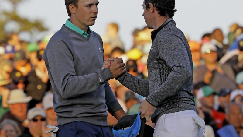 Jordan Spieth shakes hands with Rory McIlroy on the 18th green during the third round of the Masters at Augusta on Saturday<br />Picture by AP