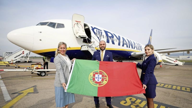 Belfast City Airport&rsquo;s commercial director Katy Best joins Ryanair cabin crew members Izar Parrondo and Cristina Giudici to welcome the first passengers on board the inaugural Ryanair flight from the airport. Picture: Kelvin Boyes/PressEye 
