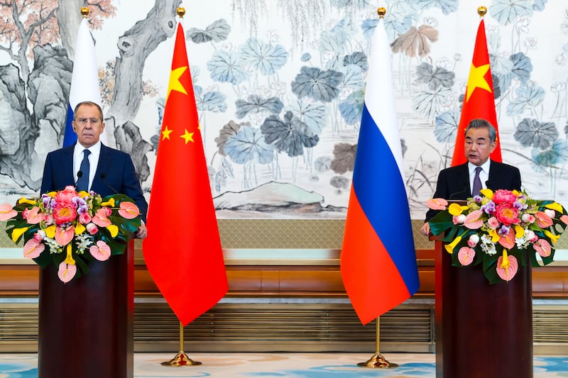 Russian foreign minister Sergey Lavrov and Chinese foreign minister Wang Yi (Russian Foreign Ministry Press Service via AP)
