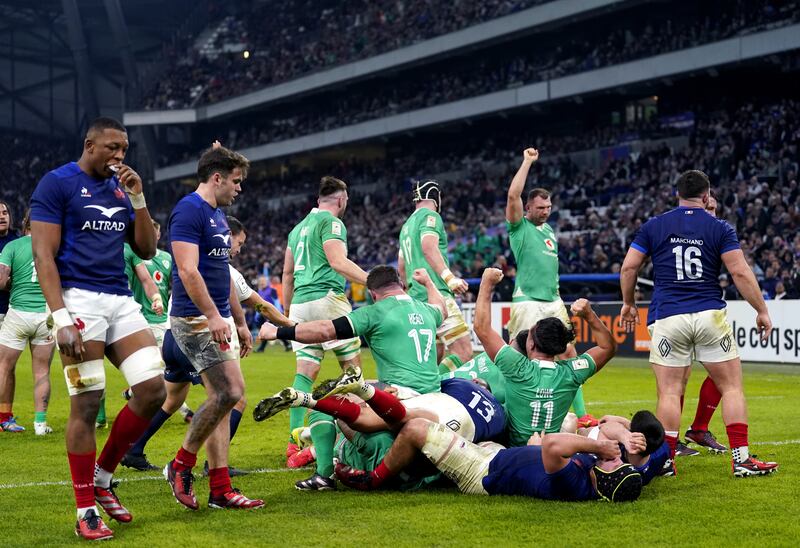 Ireland players celebrate after Ronan Kelleher (blocked) scores