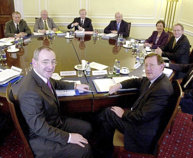 The then deputy first minister Mark Durkan at the executive table with David Trimble in 2001. Picture By Stephen Wilson/Pacemaker