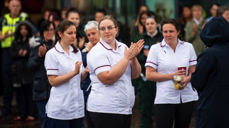 &nbsp;Staff members applaud outside the Royal Derby Hospital, following a minute's silence to pay tribute to the NHS staff and key workers who have died during the coronavirus outbreak. Picture by Jacob King, Press Association