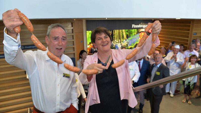 Finnebrogue&rsquo;s chairman Denis Lynn and First Minister Arlene Foster officially open the new &pound;25 million processing facility in Downpatrick by cutting a ribbon of sausages 
