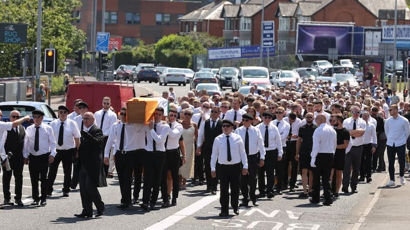 A large crowd attended Joe Clarke's funeral in Belfast on Thursday