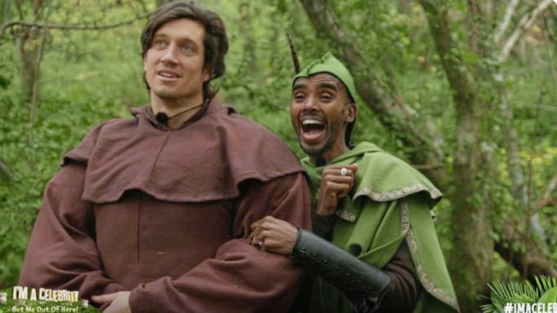 Mo Farah as Robin Hood and Vernon Kay as Friar Tuck in an I'm A Celebrity challenge. Picture from I'm A Celebrity on Twitter