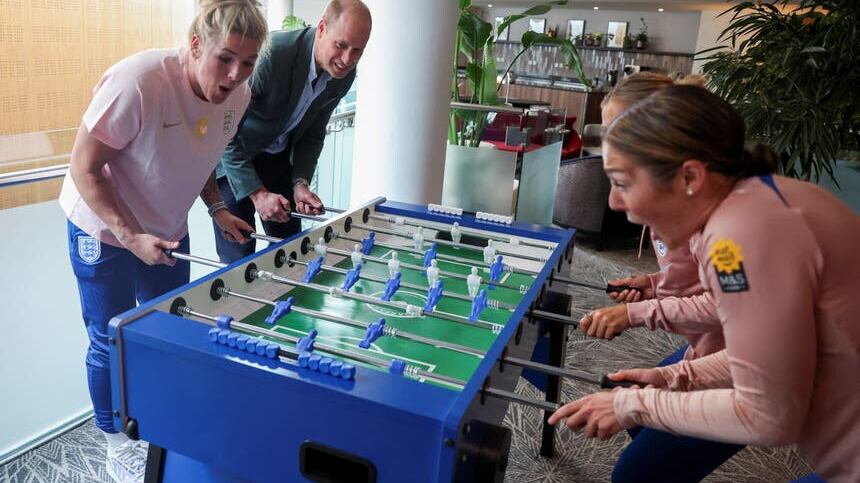 The Prince of Wales plays table football with members of England Women’s football team (Phil Noble/PA)