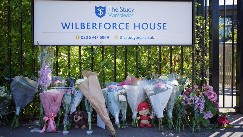 Flowers and toys placed outside the Study Preparatory School (Yui Mok/PA)