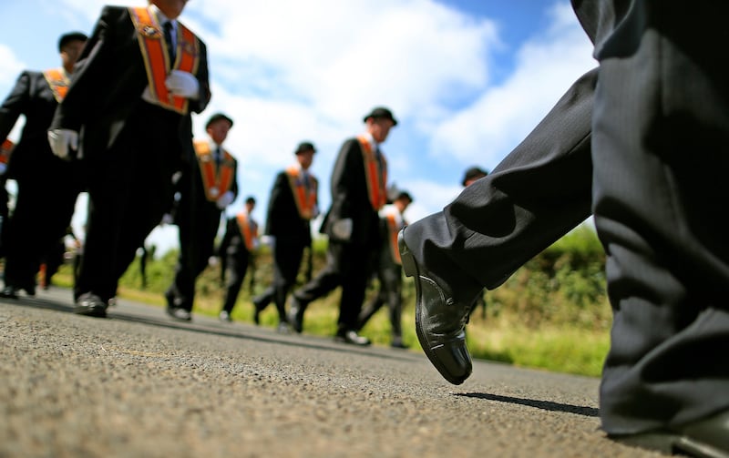Orange Order members parade along Drumcree Road outside Portadown (Julien Behal/PA)